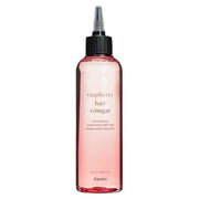 Bouteille rose de Raspberry Hair Vinegar avec bouchon applicateur noir.